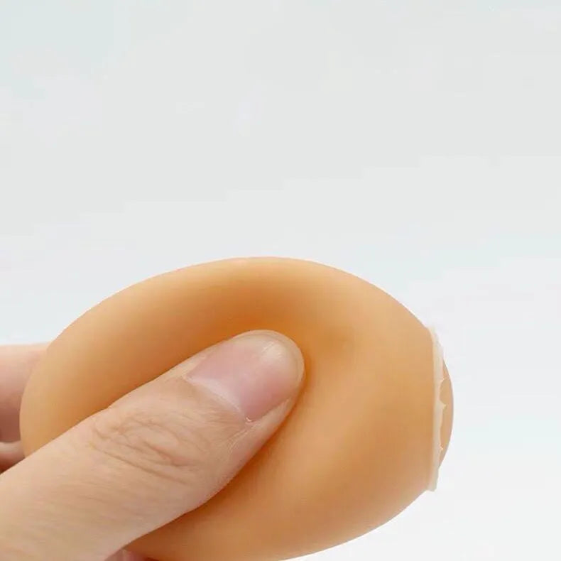 White simulation egg dog toy with textured surface for squeaking sound and tooth cleaning