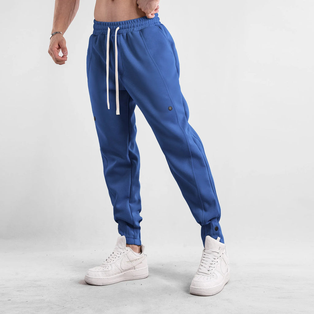 Men's cotton loose fit casual sports trousers in light blue, side view, with mid waist and straight leg