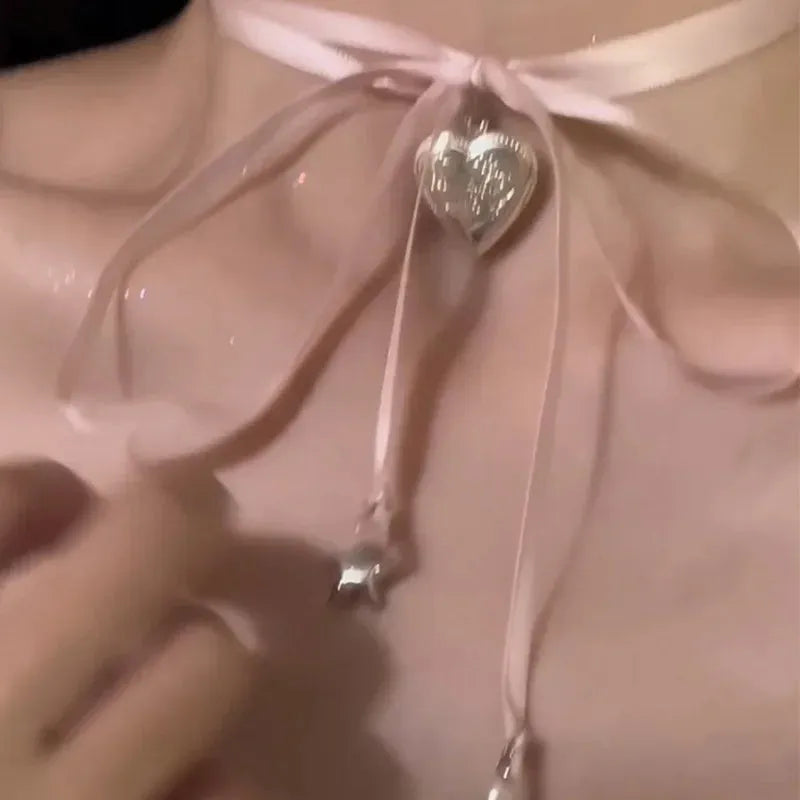 Women's alloy clavicle chain necklace with ribbon pendant featuring heart charm in multiple colour options