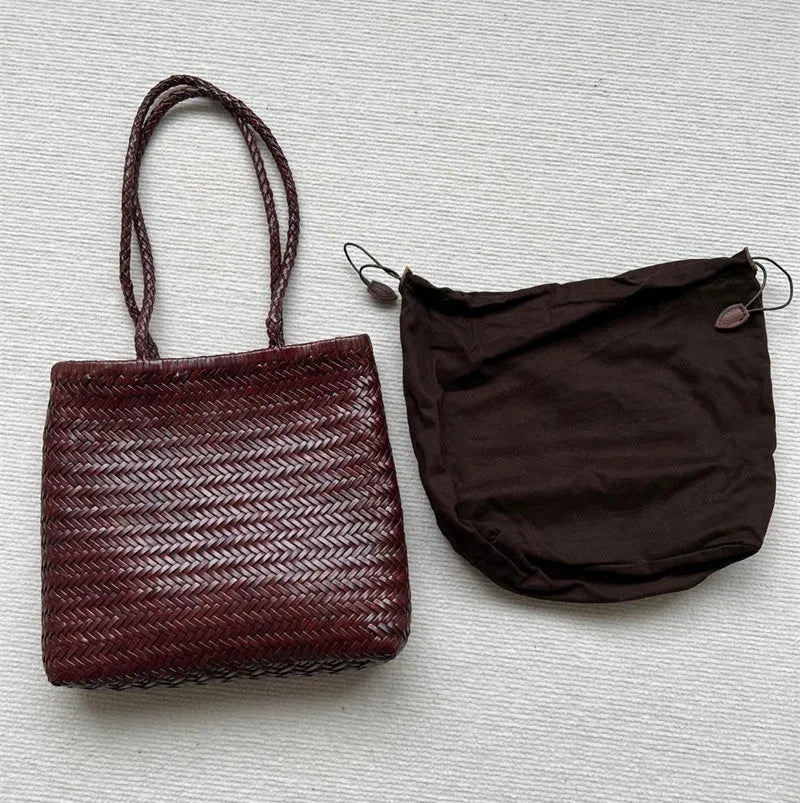 Brown woven leather tote bag with three-dimensional pockets and shoulder straps