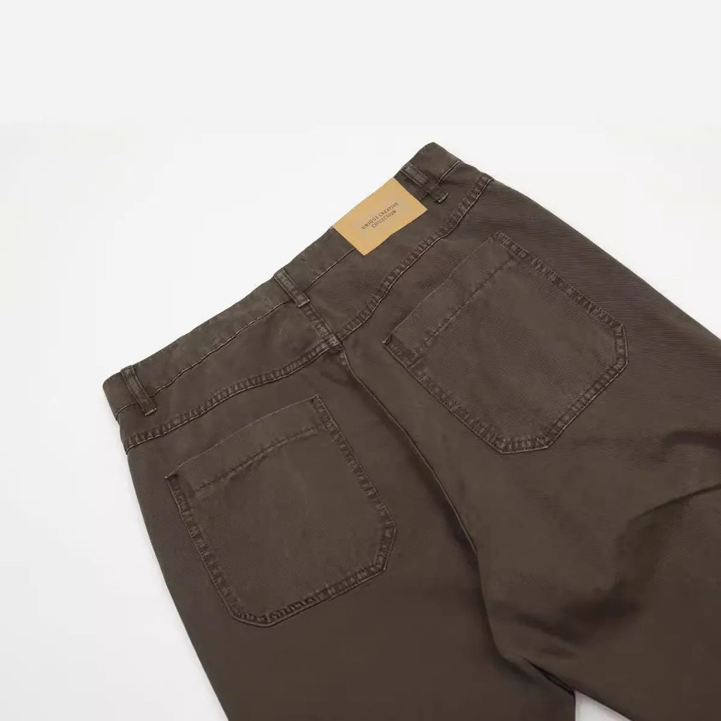 Men's brown loose straight wide-leg high-waisted cotton trousers laid flat.