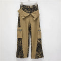 Retro high waist straight-leg jeans with leopard print tooling details on dark khaki denim