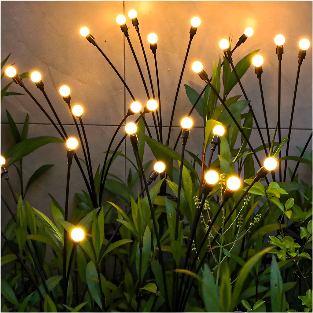 Solar-powered LED firefly ground lamp with multiple heads and ground spike for garden installation
