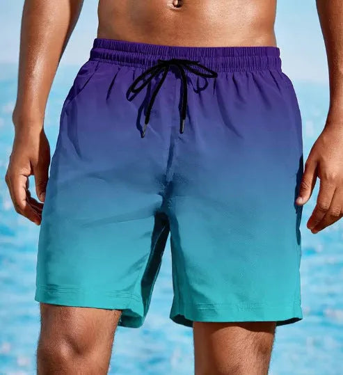Men's grey and blue gradient 3D print mesh sports shorts on a white background.