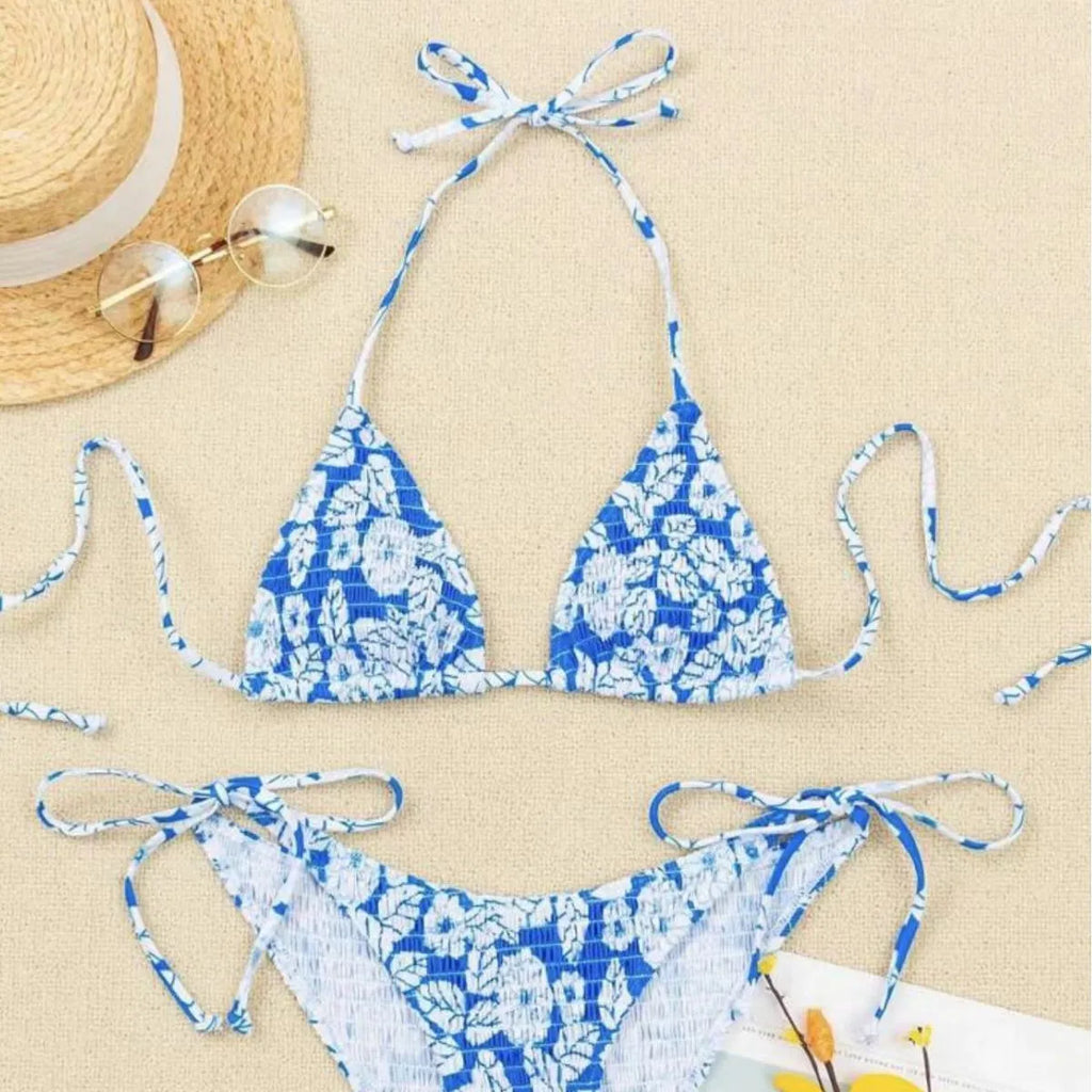 Women's floral pattern halter swimsuit briefs in light blue on a mannequin