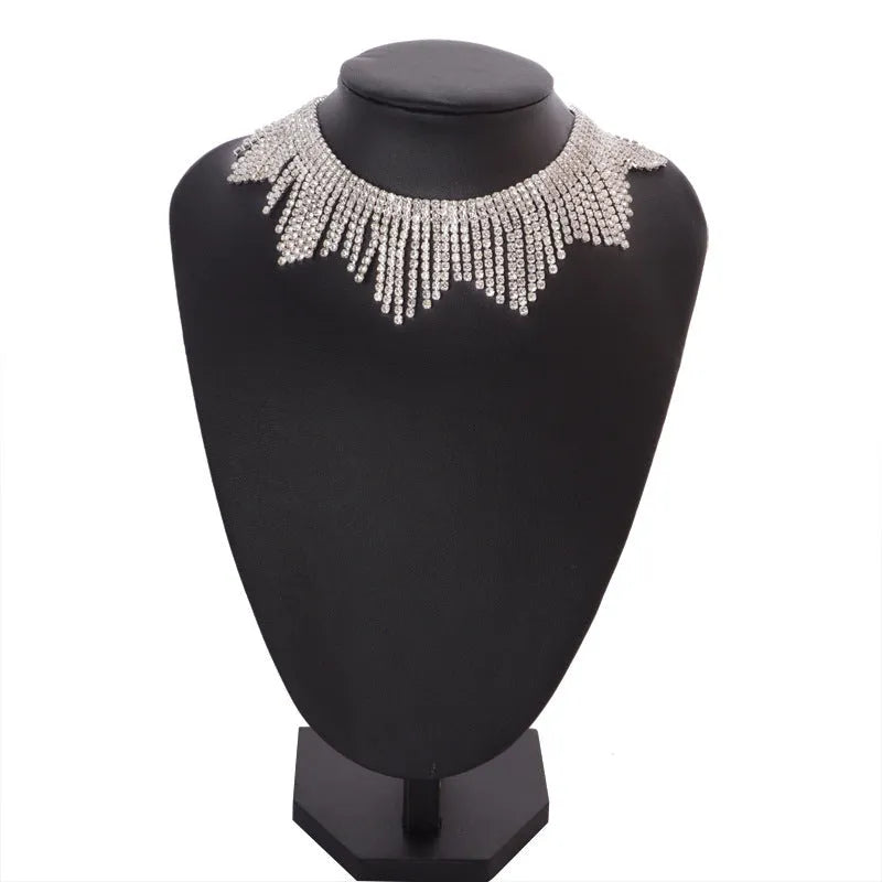 Alloy necklace with gold electroplated finish, geometric tassel pendant, diamond centre, box chain on white background