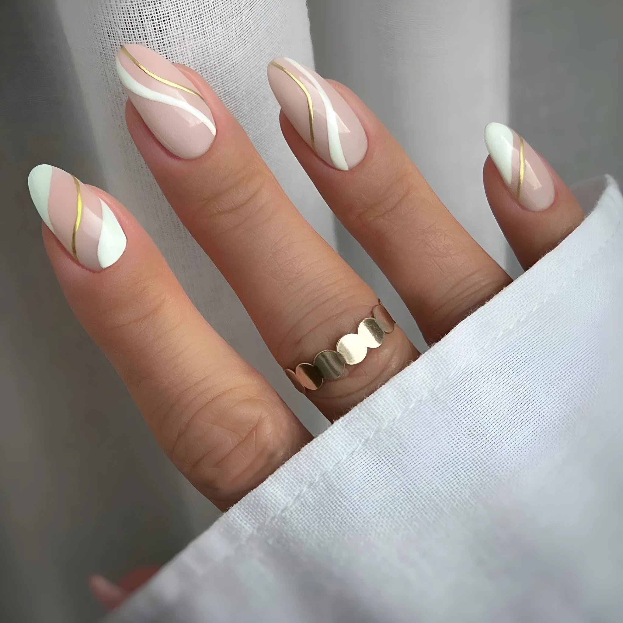 Plaid pattern plastic nail stickers in jelly glue colour on a medium, drop-shaped wearable base.
