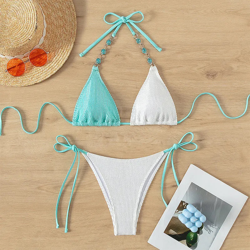 Women's two-piece swimsuit with lace-up front and pearl chain details in colour matching nylon.