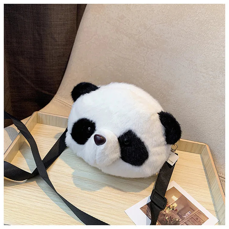 Soft plush cylindrical panda head crossbody bag showing front sandwich pocket.