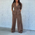 Brown polyester men's suit with slim fit waist, long sleeves, and matching trousers