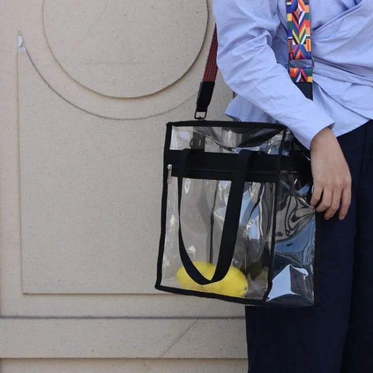 Women's transparent PVC front crossbody messenger bag with black side net pocket and double shoulder straps.