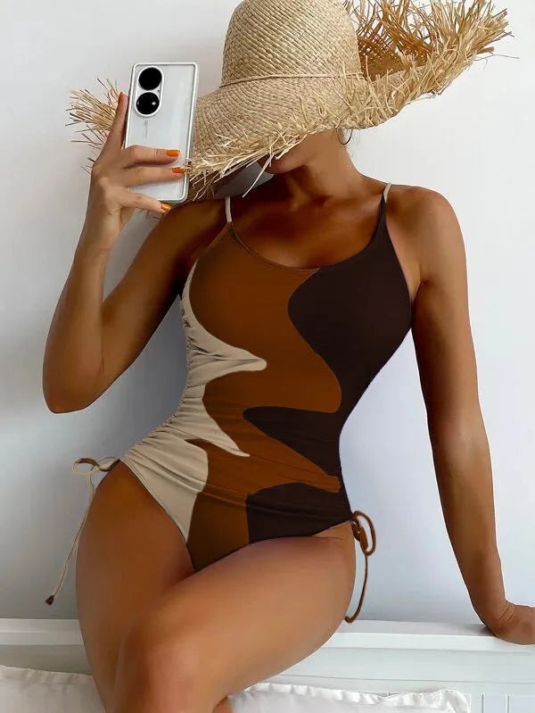Women's blue sleeveless backless one-piece swimsuit on hanger