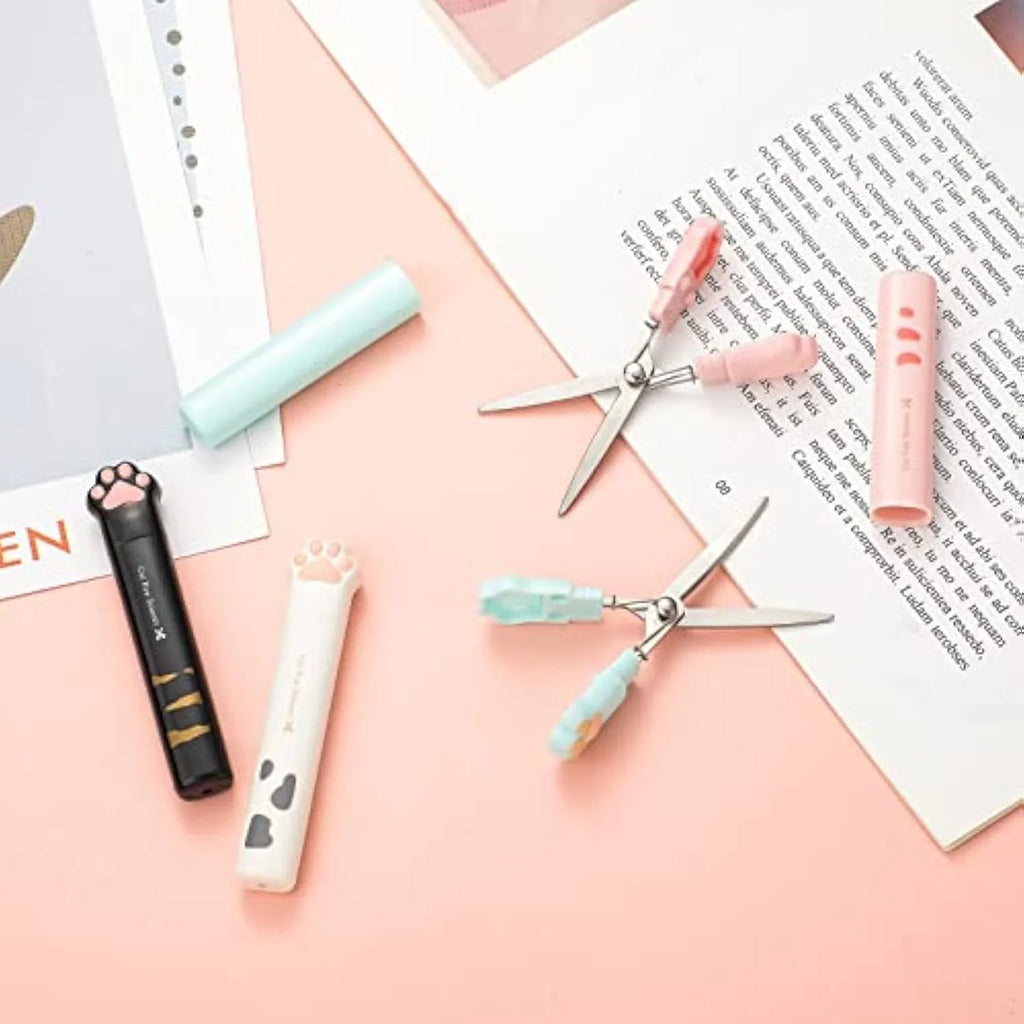 Cat paw mini folding scissors showing stainless steel blades and decorative claw design in four colour options