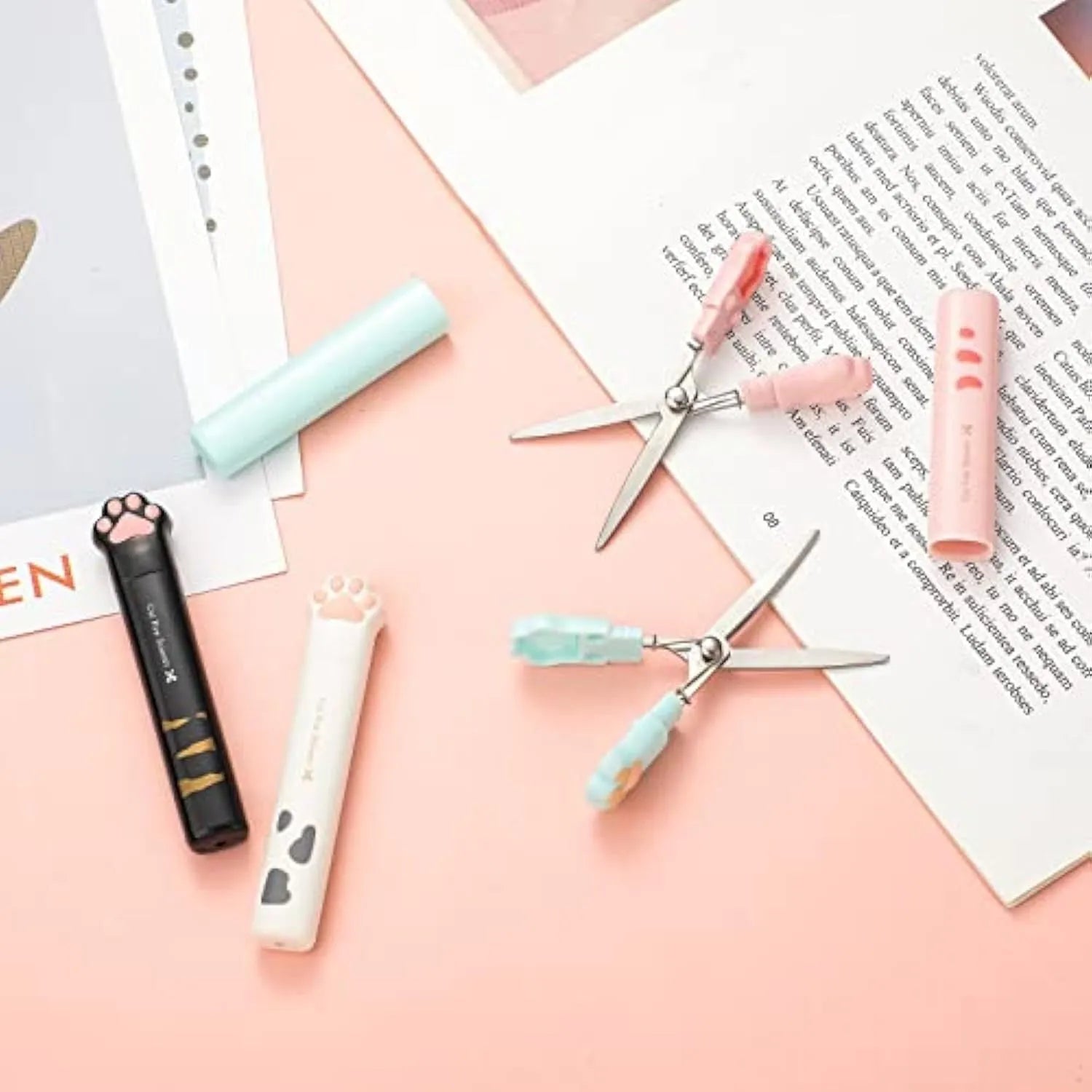Cat paw mini folding scissors showing stainless steel blades and decorative claw design in four colour options