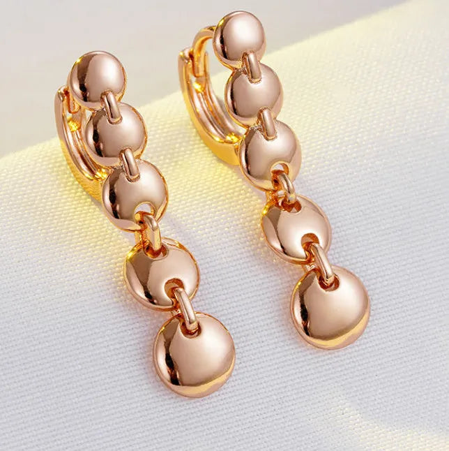 Gold-coloured retro circle earrings with 8cm diameter woven copper construction