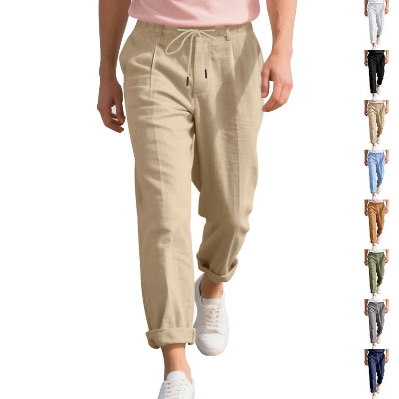 Men's light khaki linen casual trousers with a drawstring waistband and straight-leg silhouette.