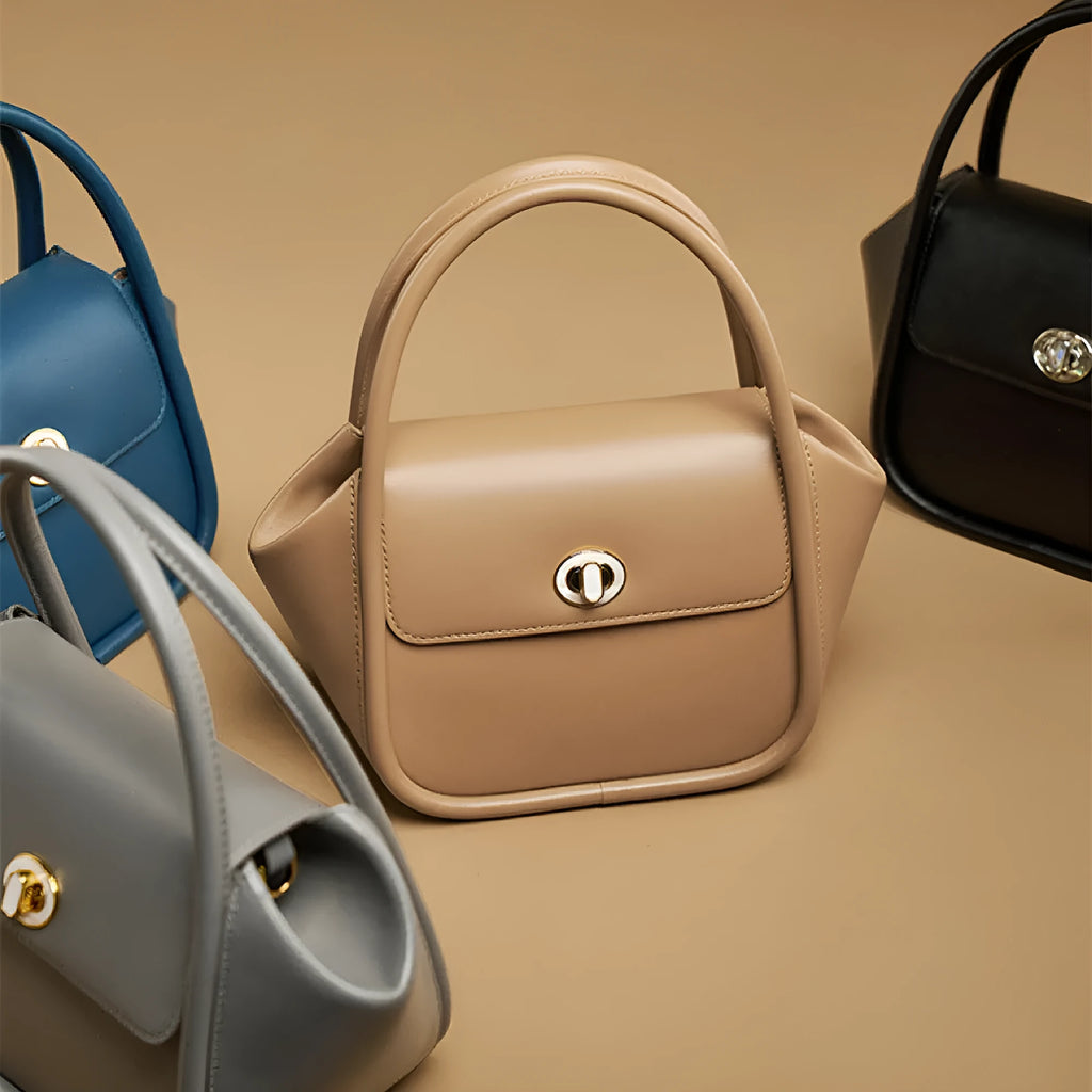 Genuine cow leather wing-shaped tote bag with buckle detail and cross-body shoulder strap