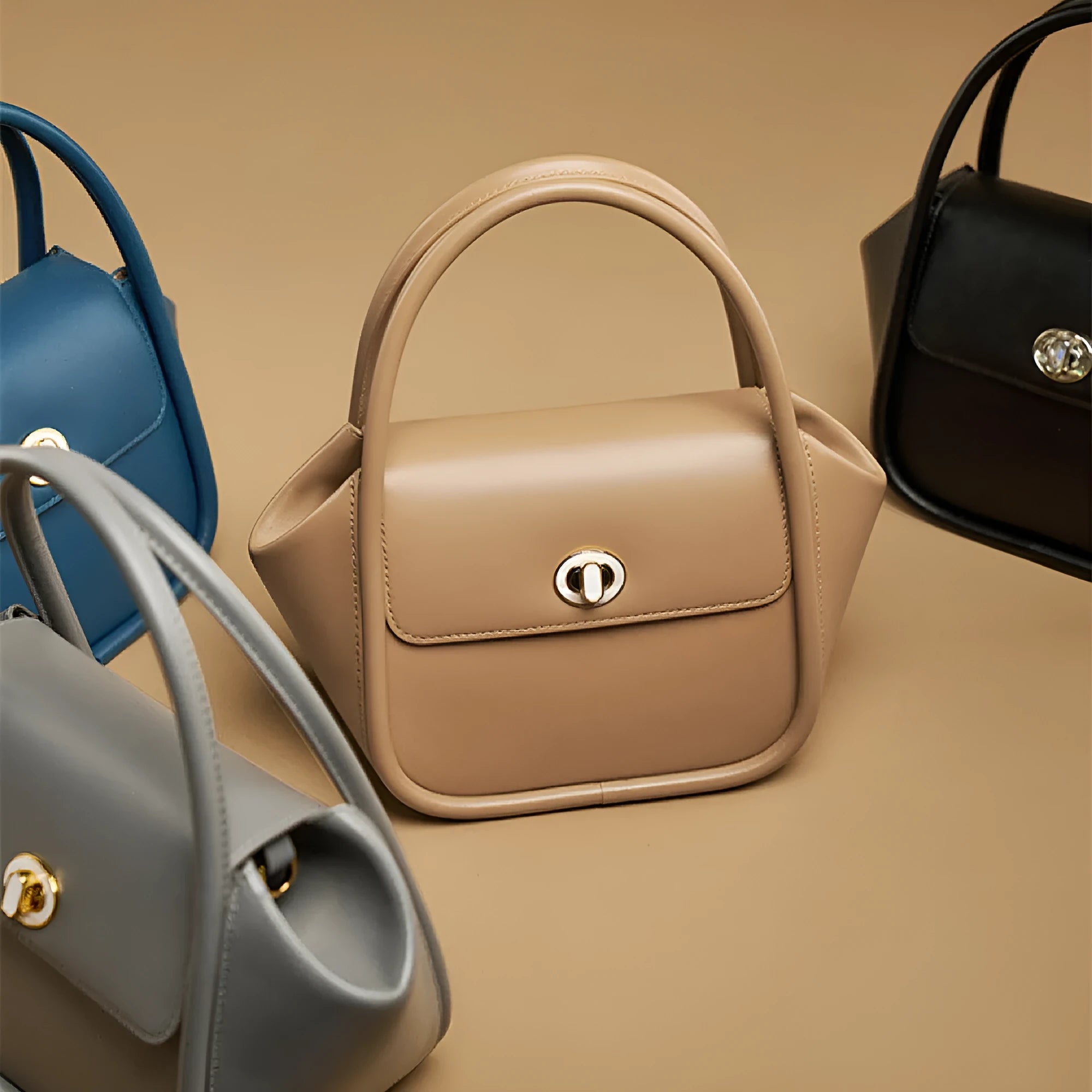 Genuine cow leather wing-shaped tote bag with buckle detail and cross-body shoulder strap