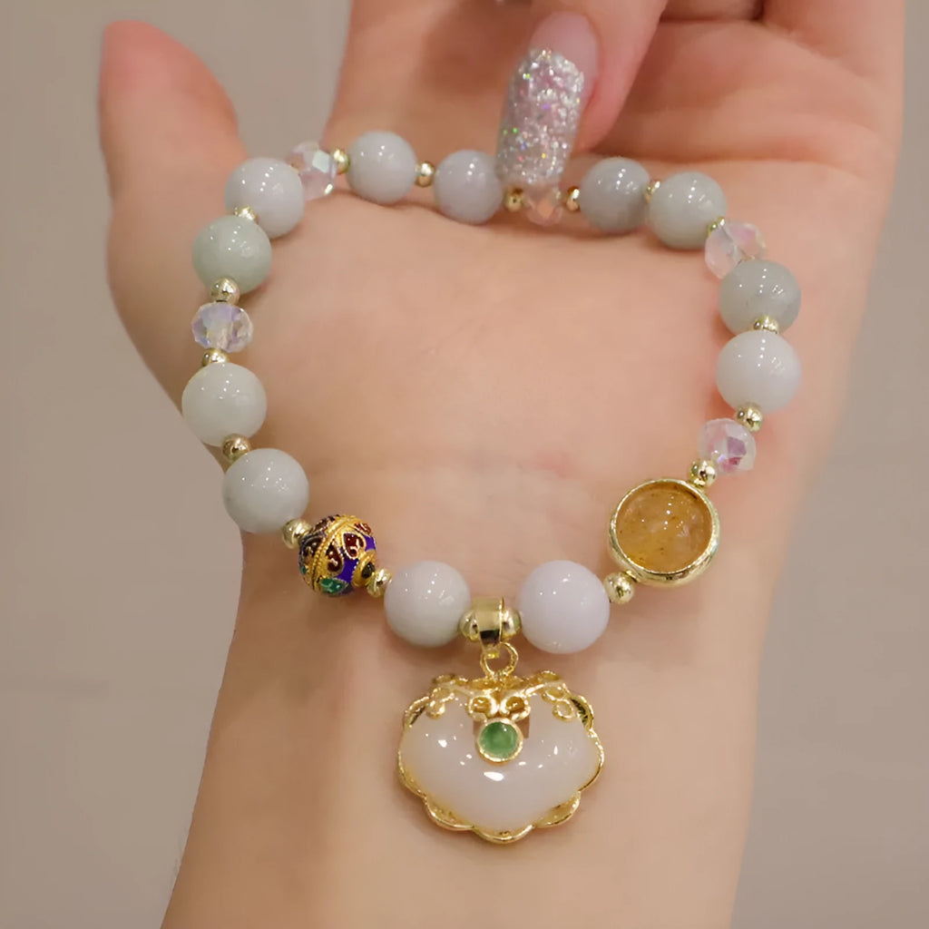 Geometric ethnic bracelet with strawberry quartz stones and metal decoration