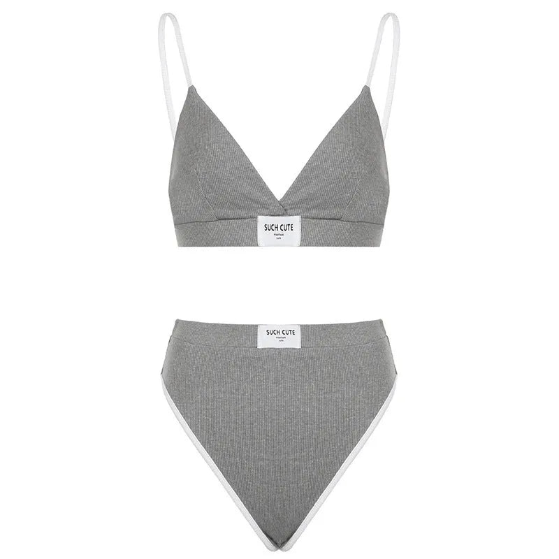 Women's black embroidered contrast binding bikini set made from polyester fabric.