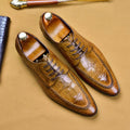 Men's black leather formal shoes with alligator pattern texture and a horse bit buckle detail.