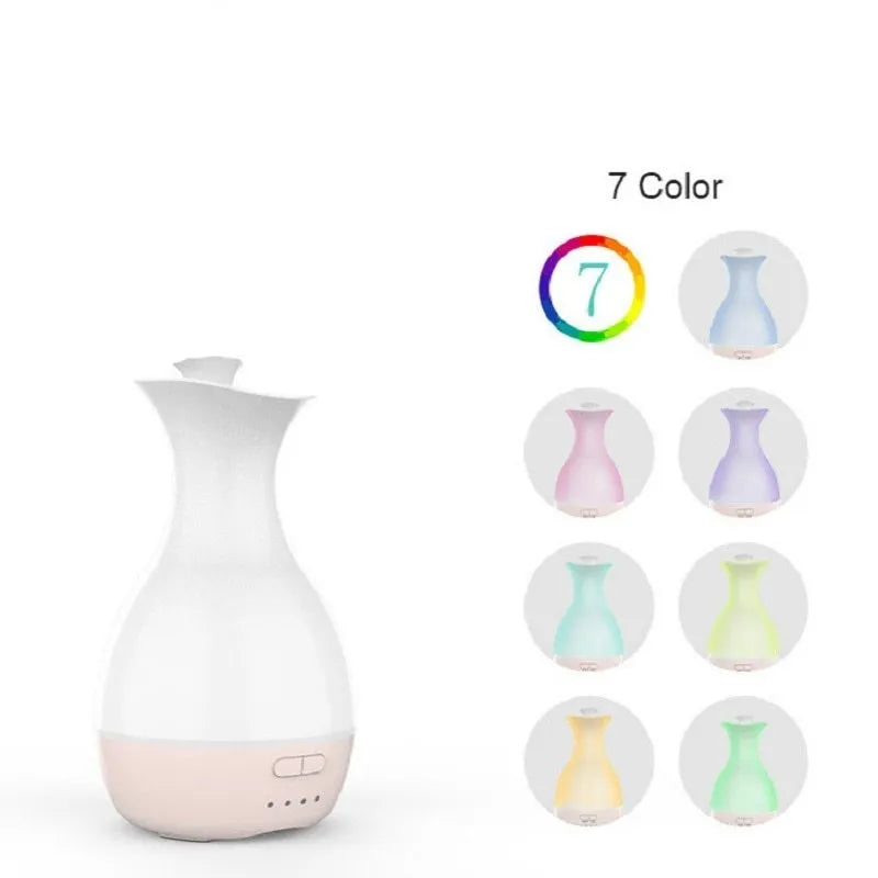 White or pink ultrasonic aroma diffuser vase with colourful LED night light and water tank.