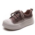 Yellow women's leather lace-up casual shoes with round toe on a plain background.