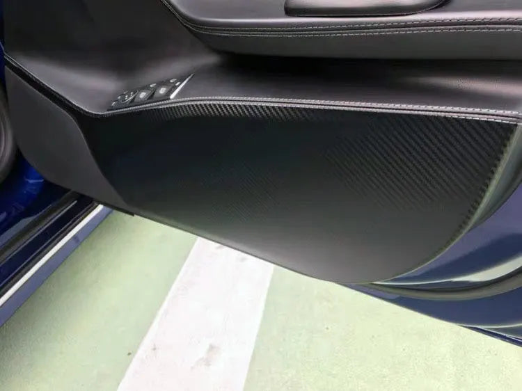 Carbon fibre protective film for Tesla Model S interior door panels showing control layout cutouts