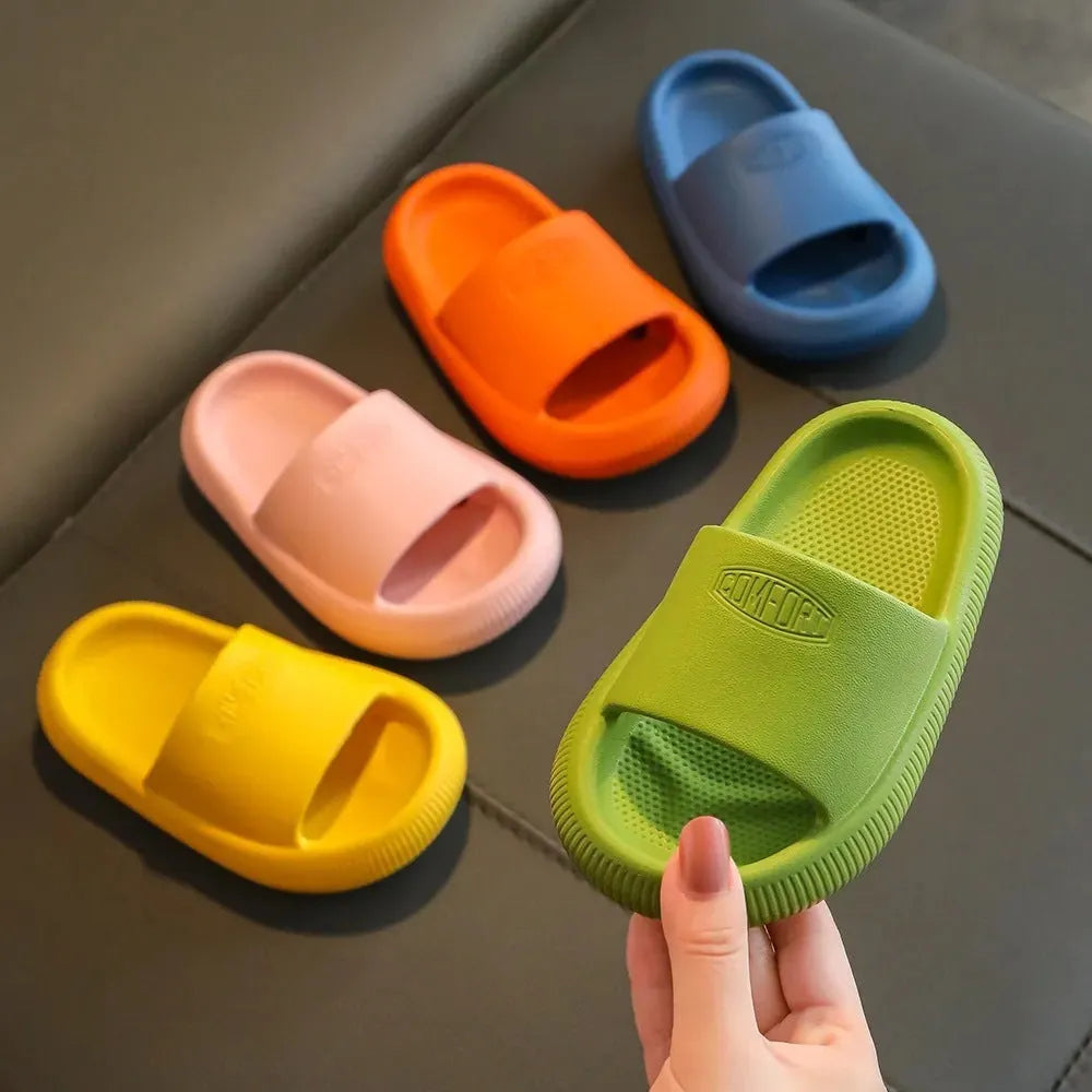 Children's EVA injection-moulded slippers with non-slip soles in mixed colours, shown in multiple sizes.