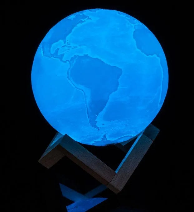 3D printed white moon lamp with detailed craters on a dark background, showing touch ring at base.