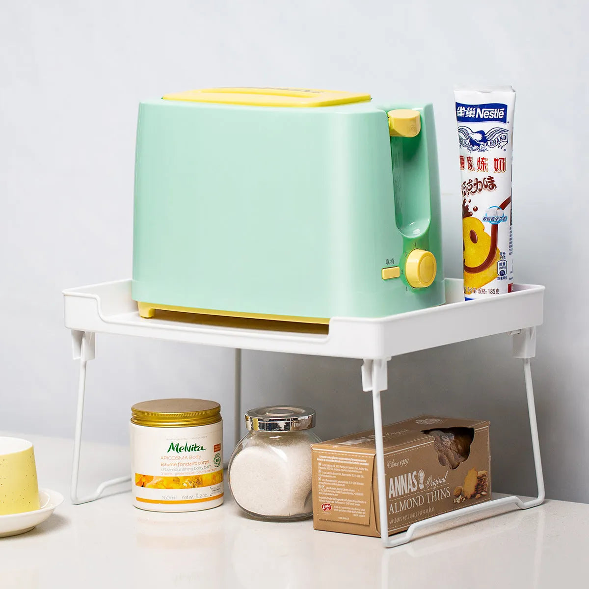 Plastic kitchen supplies rack for organising utensils on desktop or in cupboard storage