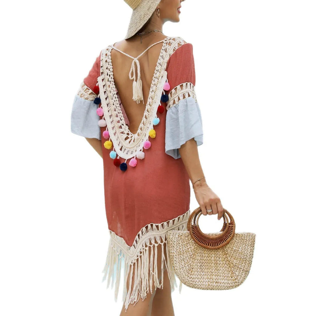 Orange floral pattern beach overskirt with hand crochet stitching and tassel detailing.