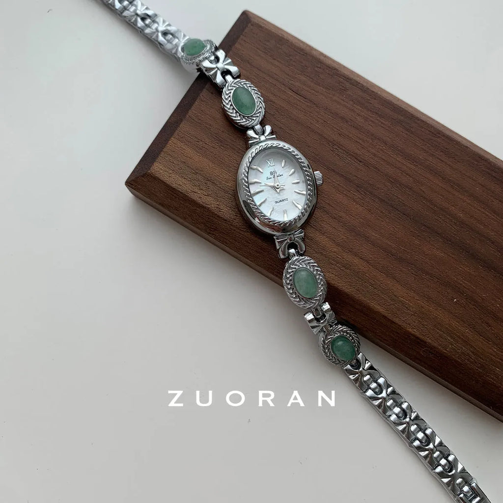Green jade ladies quartz watch with silver case and white face