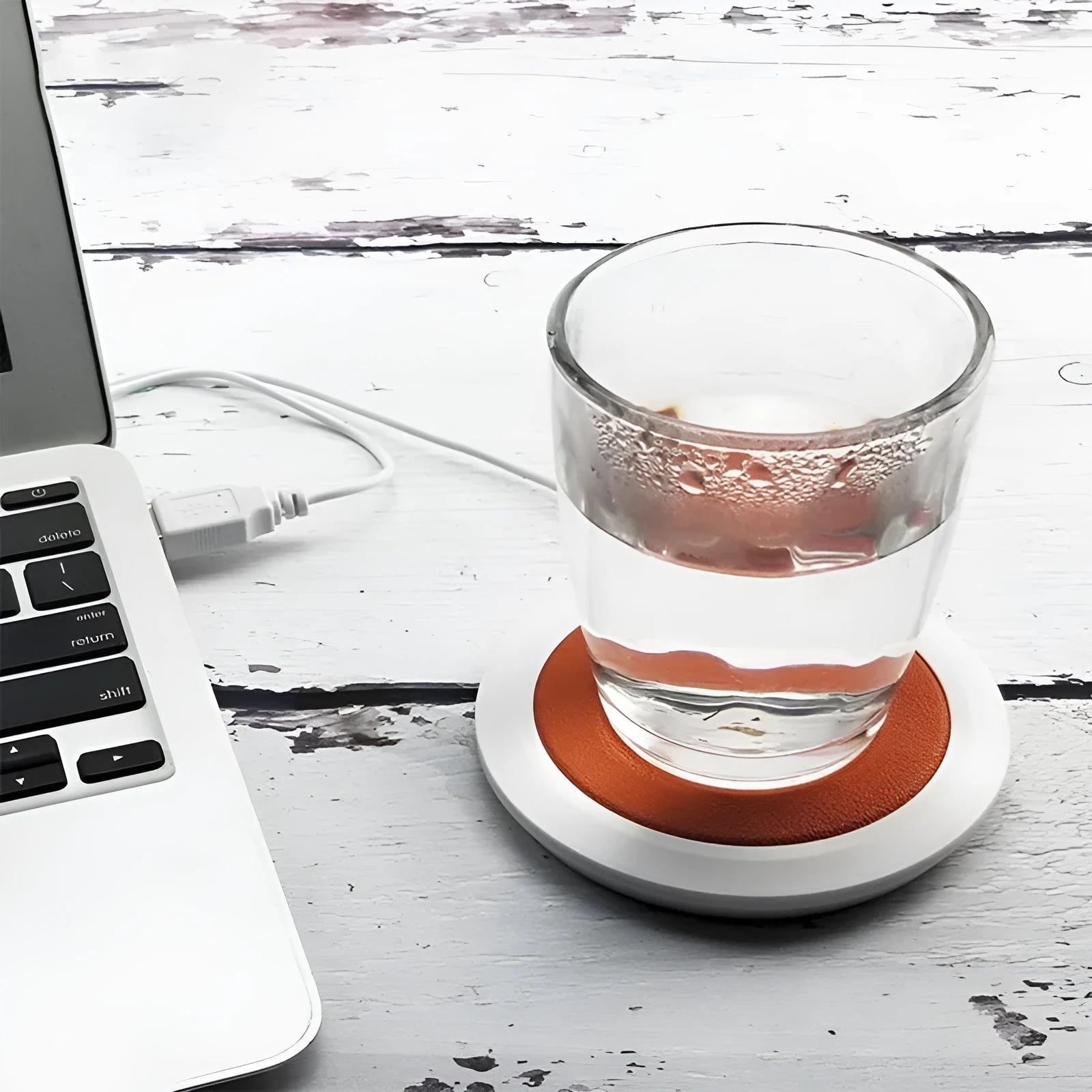 Black USB-powered heating coaster with high temperature heater for desk use.