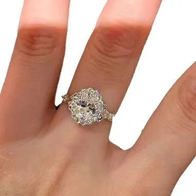 Silver geometric women's ring with large diamond centrepiece and adjustable opening.