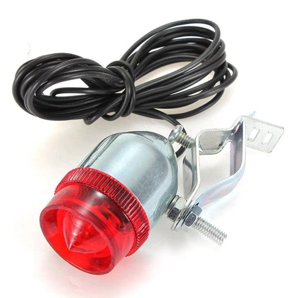 Silver bicycle dynamo generator light modification kit showing mounting bracket and wiring connections