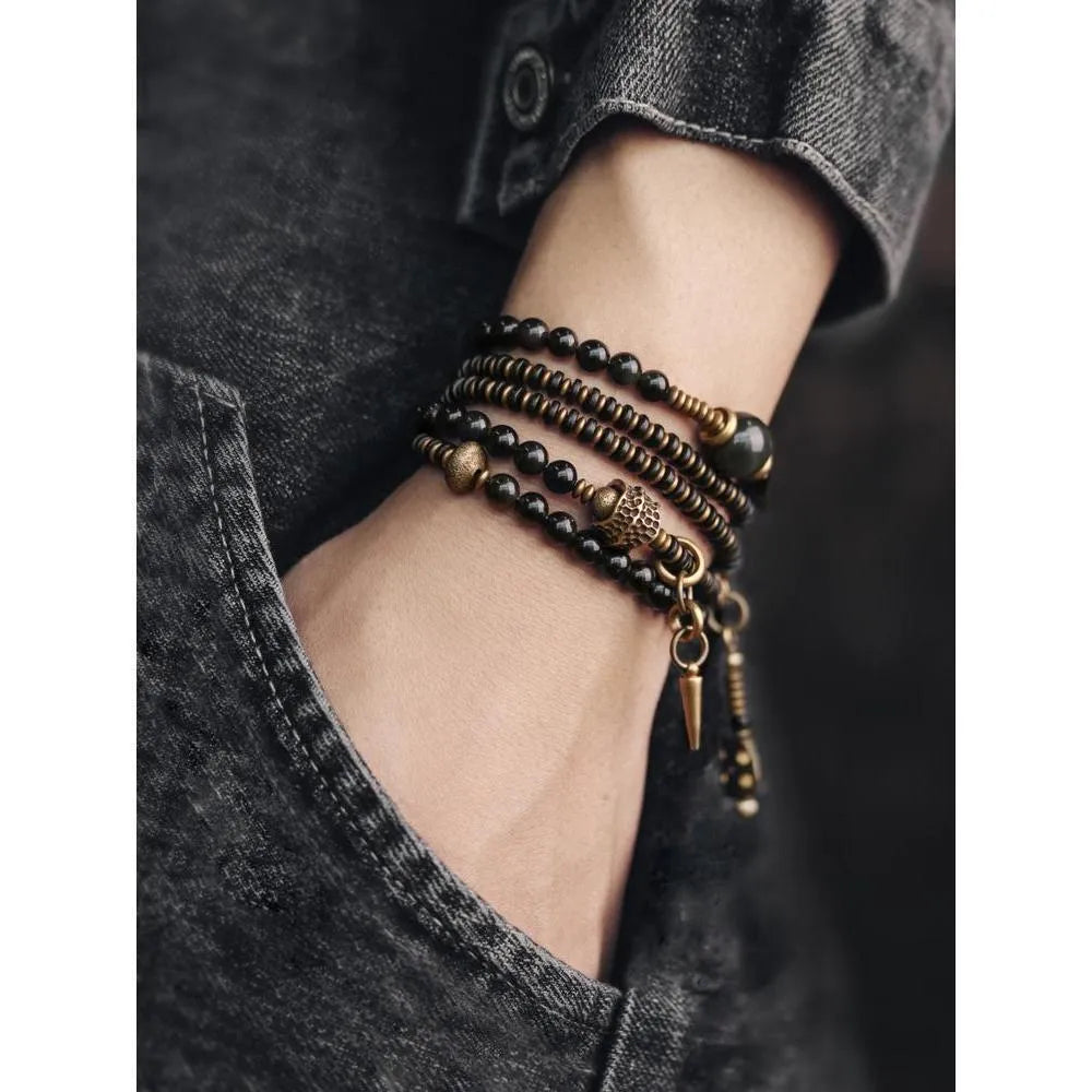 Black geometric layered bead bracelet with retro colourful design elements