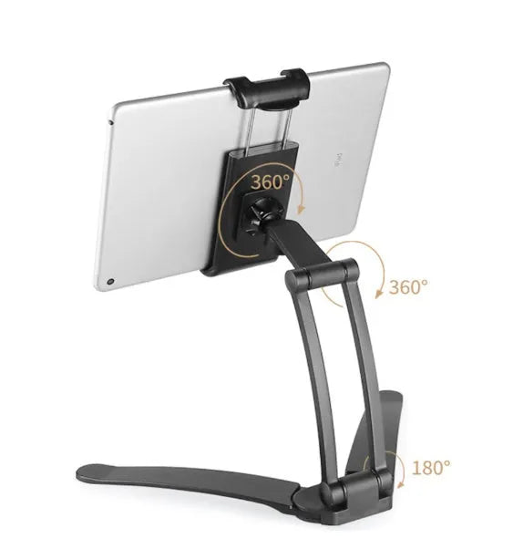 Silver aluminum alloy desktop stand holding a tablet at an angle, showing its adjustable clip and 360-degree rotation base.