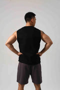 Men's loose black cotton fitness vest showing hidden hook side openings.