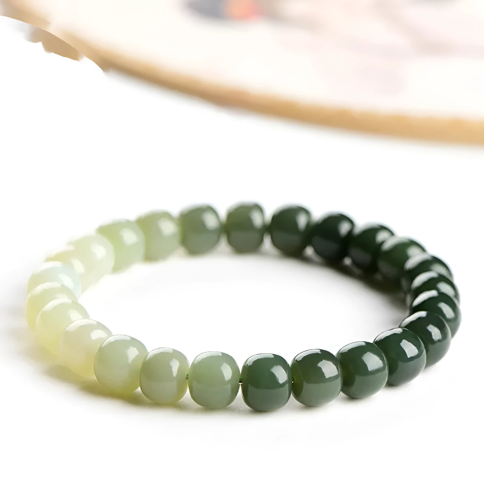 Natural Hetian Jade bracelet with water gradient colour and polished beads in unisex casual style.