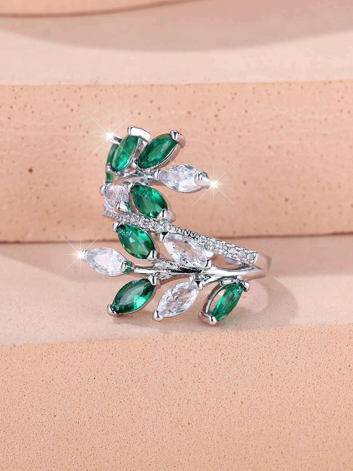 Adjustable horse eye design leaf ring in copper with zircon crystals, shown in a rose gold finish