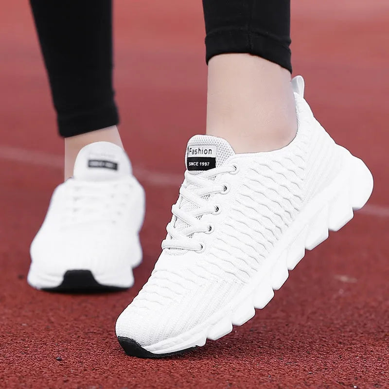 Women's running shoes with fly weaving upper in black, pink, or white colours, showing durable outsole.
