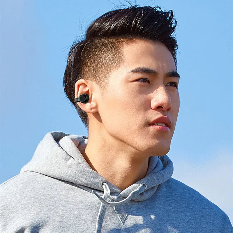 Black wireless Bluetooth headset with clip-on bone conduction earphones for exercise