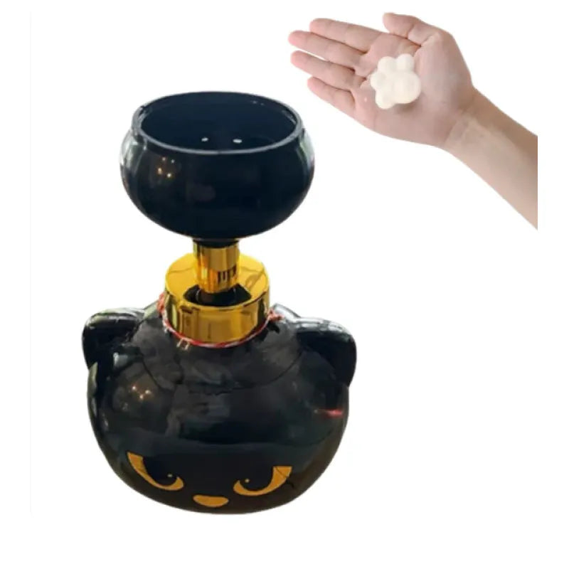 Black plastic cat-shaped cartoon foam soap dispenser pump bottle on a countertop.