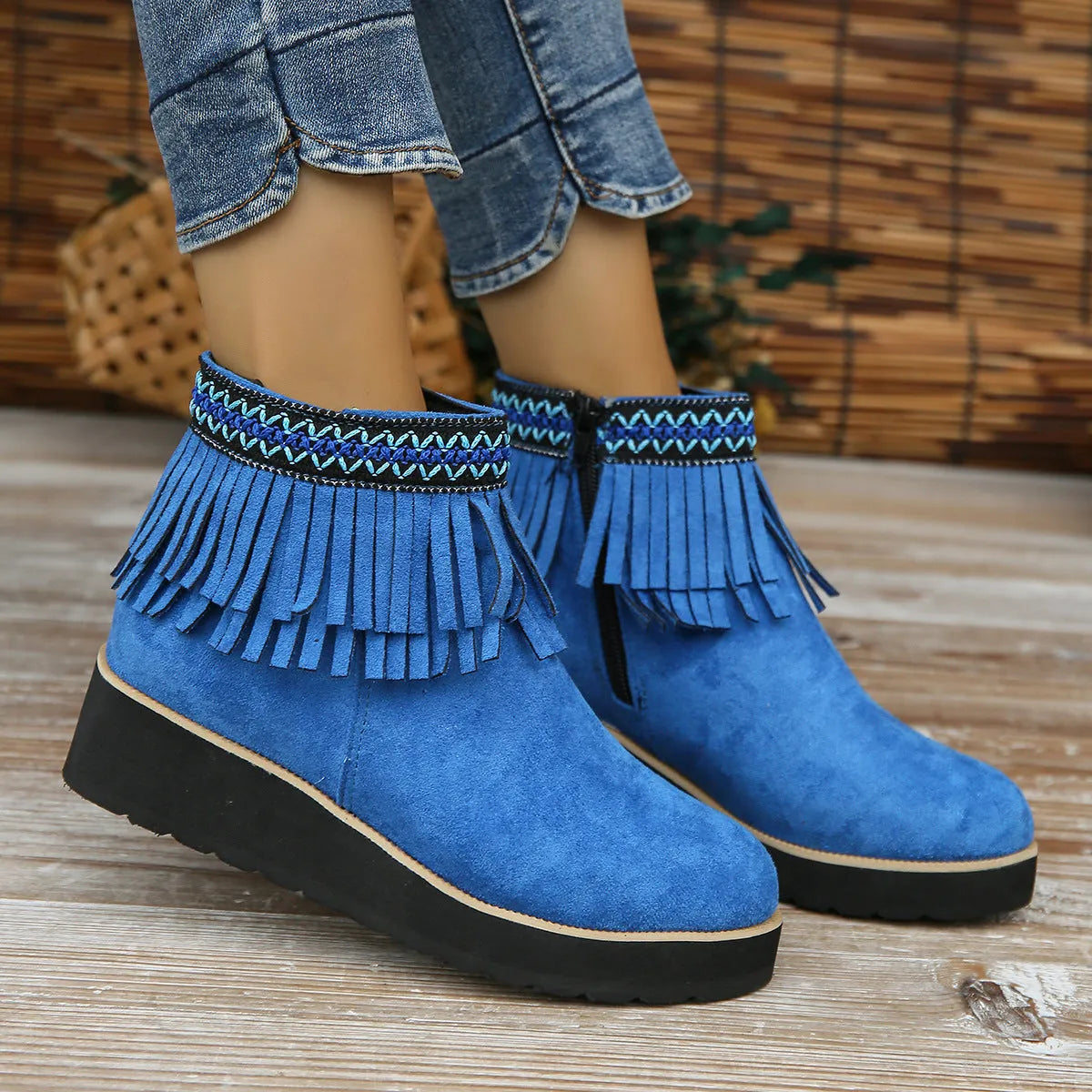 Women's dark brown suede wedge ankle boots with side zip and decorative tassel.
