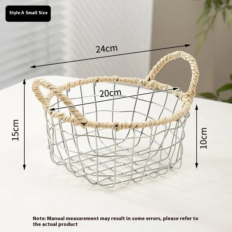 Nordic iron wire woven storage basket in binaural woven style, small size, containing fruit on a kitchen countertop