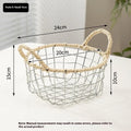 Nordic iron wire woven storage basket in binaural woven style, small size, containing fruit on a kitchen countertop