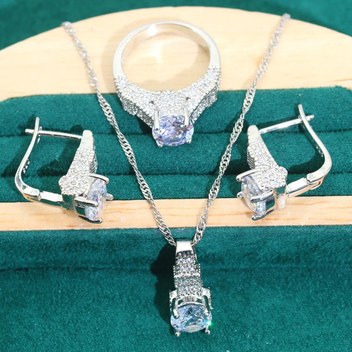 Bridal zircon jewellery four-piece set showing necklace, bracelet, earrings and ring in alloy with water wave chain
