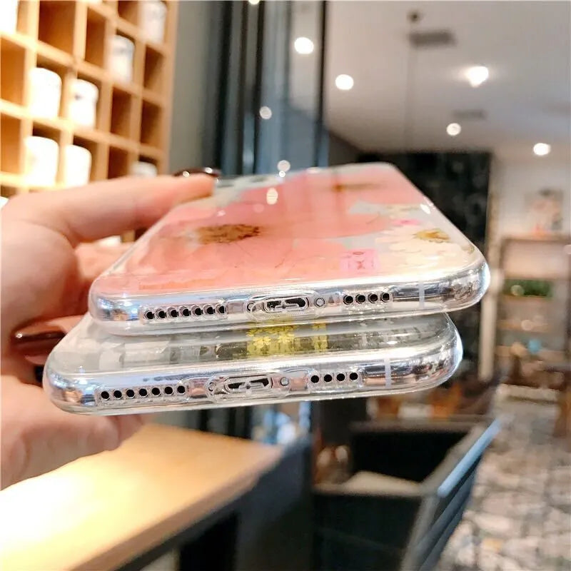 Slim TPU iPhone case with a large pink floral print on the back.