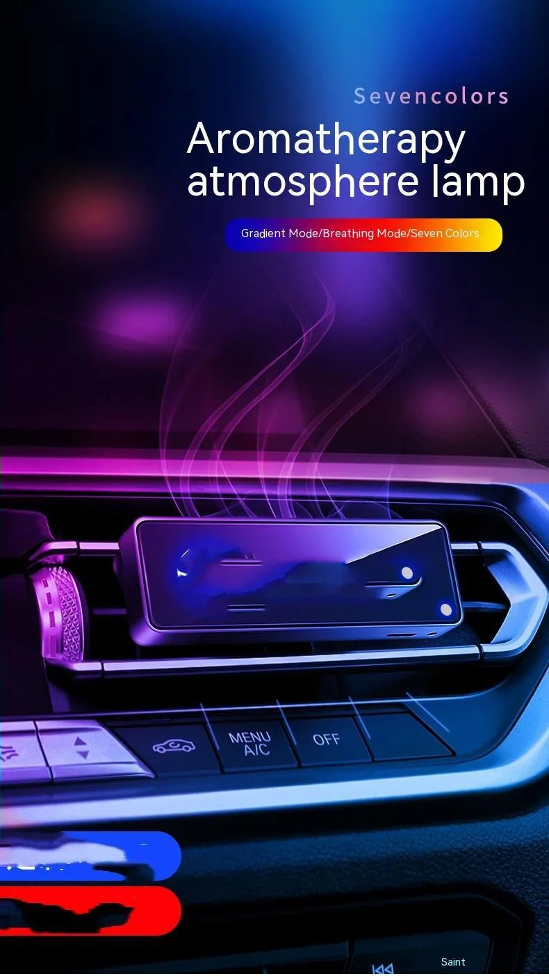 Black automobile air vent clip with LED light and aromatherapy diffuser for car odour removal.